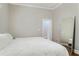 Main bedroom with a king-size bed and full-length mirror at 1068 N Main Nw St, Conyers, GA 30012