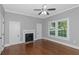 Bedroom with hardwood floors, ceiling fan, fireplace and windows at 1068 N Main Nw St, Conyers, GA 30012