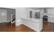 White kitchen with island and stainless steel appliances at 1068 N Main Nw St, Conyers, GA 30012