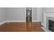 Hardwood floors, fireplace and view into another room at 1068 N Main Nw St, Conyers, GA 30012