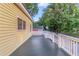 Spacious deck with white railings and access to the backyard at 1068 N Main Nw St, Conyers, GA 30012
