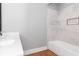 Bathroom with white vanity, quartz countertop and bathtub at 1068 N Main Nw St, Conyers, GA 30012