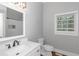 Modern bathroom with white vanity and shower at 1068 N Main Nw St, Conyers, GA 30012