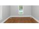 Bright bedroom with hardwood floors and window at 1068 N Main Nw St, Conyers, GA 30012