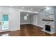 Open floor plan, hardwood floors, and white kitchen at 1068 N Main Nw St, Conyers, GA 30012