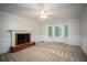 Living room featuring a brick fireplace and large windows at 1080 Chestnut Hill Sw Cir, Marietta, GA 30064