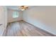 Well-lit bedroom with hardwood floors and ceiling fan at 5332 Zachary Dr, Stone Mountain, GA 30083