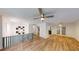 Bright living room with hardwood floors and access to kitchen and dining area at 5332 Zachary Dr, Stone Mountain, GA 30083