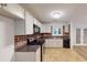 Updated kitchen boasts granite countertops and white cabinets at 5332 Zachary Dr, Stone Mountain, GA 30083
