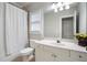 Simple bathroom with shower, toilet, and vanity at 6159 Fernstone Nw Ct, Acworth, GA 30101