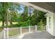 Deck overlooking a wooded backyard with a golf course view at 6159 Fernstone Nw Ct, Acworth, GA 30101