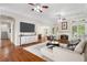 Spacious living room with hardwood floors, fireplace and large windows at 6159 Fernstone Nw Ct, Acworth, GA 30101