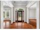 Elegant entryway with hardwood floors, arched doorway, and stained-glass details at 6159 Fernstone Nw Ct, Acworth, GA 30101