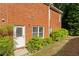 Brick exterior with private entrance and well-maintained landscaping at 6159 Fernstone Nw Ct, Acworth, GA 30101