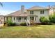 House back view, showing a deck and a spacious backyard at 6159 Fernstone Nw Ct, Acworth, GA 30101