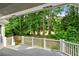 Deck with white railing and view of lush green trees at 6159 Fernstone Nw Ct, Acworth, GA 30101