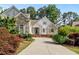 Two-story house with stone accents and a large driveway at 6159 Fernstone Nw Ct, Acworth, GA 30101