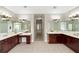 Double vanity bathroom with a view down a long hallway at 6159 Fernstone Nw Ct, Acworth, GA 30101