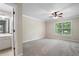 Bright bedroom with ceiling fan and ensuite bath at 6159 Fernstone Nw Ct, Acworth, GA 30101
