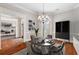 Elegant dining room with hardwood floors and a chandelier at 6159 Fernstone Nw Ct, Acworth, GA 30101