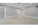 Finished basement room with tile floor and access to other rooms at 6159 Fernstone Nw Ct, Acworth, GA 30101