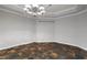 Spacious dining room featuring elegant tile floors and a stunning chandelier at 6159 Fernstone Nw Ct, Acworth, GA 30101