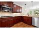 Kitchen boasts stainless steel appliances and granite countertops at 6159 Fernstone Nw Ct, Acworth, GA 30101