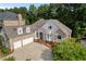 Stone and shingle luxury home with a three-car garage at 6159 Fernstone Nw Ct, Acworth, GA 30101