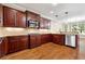 Kitchen features stainless steel appliances and hardwood floors at 6159 Fernstone Nw Ct, Acworth, GA 30101