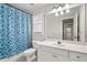 Bathroom with shower/tub combo and white vanity at 6159 Fernstone Nw Ct, Acworth, GA 30101