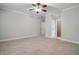 Spacious bedroom with ceiling fan and access to closet at 6159 Fernstone Nw Ct, Acworth, GA 30101