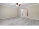 Spacious bedroom with ceiling fan and walk-in closet at 6159 Fernstone Nw Ct, Acworth, GA 30101
