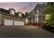 Elegant two-story home with stone accents and a three-car garage at 6159 Fernstone Nw Ct, Acworth, GA 30101