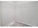 Spacious walk-in closet with wire shelving and neutral carpeting at 6159 Fernstone Nw Ct, Acworth, GA 30101