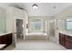 Large bathroom with soaking tub, shower, and double vanity at 6159 Fernstone Nw Ct, Acworth, GA 30101