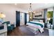 Spacious main bedroom with a large bed, sitting area, and en-suite bathroom at 499 Godfrey Dr, Cumming, GA 30040