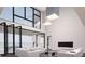 Open living room with floor-to-ceiling windows and modern fireplace at 5090 Derrick Rd, South Fulton, GA 30349
