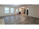 Open living room and kitchen with grey flooring at 3139 Redwood Run, Atlanta, GA 30349