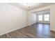 Spacious dining room featuring wood-look flooring and a chandelier at 3139 Redwood Run, Atlanta, GA 30349