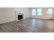 Living room with fireplace and gray vinyl flooring at 3139 Redwood Run, Atlanta, GA 30349