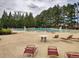 Community pool with lounge chairs and tables at 3139 Redwood Run, Atlanta, GA 30349
