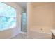 Bathroom with shower, bathtub and window at 3139 Redwood Run, Atlanta, GA 30349