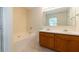 Bathroom with double vanity, bathtub and large mirror at 3139 Redwood Run, Atlanta, GA 30349