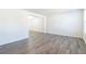 Open living area with gray vinyl flooring and neutral walls at 3139 Redwood Run, Atlanta, GA 30349