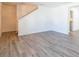 Living room with gray vinyl flooring and access to kitchen at 3139 Redwood Run, Atlanta, GA 30349