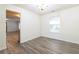 Dining room with gray vinyl flooring and a chandelier at 3139 Redwood Run, Atlanta, GA 30349