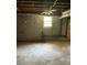 Unfinished basement with window and ceiling fan at 4193 Dunmore Rd, Decatur, GA 30034