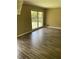 Bright dining room featuring hardwood floors and a large window at 4193 Dunmore Rd, Decatur, GA 30034