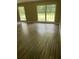 Living room with hardwood floors and large windows at 4193 Dunmore Rd, Decatur, GA 30034