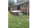 Brick patio with steps leading to the yard at 4193 Dunmore Rd, Decatur, GA 30034